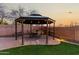 Charming backyard gazebo with seating area offering a relaxing and inviting outdoor space at 2435 W Via Dona Rd, Phoenix, AZ 85085