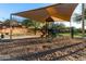 Community playground with shade structure, play equipment, and seating areas at 2435 W Via Dona Rd, Phoenix, AZ 85085