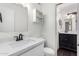 Modern bathroom featuring a white vanity, quartz countertop, and decorative mirror at 3046 N 32Nd St # 328, Phoenix, AZ 85018