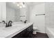 Elegant bathroom with double vanity, quartz countertop, and tiled shower at 3046 N 32Nd St # 328, Phoenix, AZ 85018