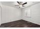 Bedroom with hardwood floors, a ceiling fan, white brick accent wall and a white window shutter at 3046 N 32Nd St # 328, Phoenix, AZ 85018