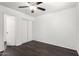 Bedroom featuring hardwood floors, a ceiling fan, neutral paint, and a closet with bi-fold doors at 3046 N 32Nd St # 328, Phoenix, AZ 85018