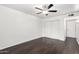 Bedroom with wood-look floors, neutral paint, and closet with sliding doors at 3046 N 32Nd St # 328, Phoenix, AZ 85018