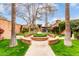 Beautiful courtyard with lush landscaping and manicured lawn at 3046 N 32Nd St # 328, Phoenix, AZ 85018