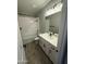 Bathroom featuring a combination shower and bathtub, white cabinetry, and a single vanity at 34997 N Sacramento Wash Rd, San Tan Valley, AZ 85144