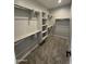 Spacious walk-in closet features ample shelving and hanging space for optimal organization at 34997 N Sacramento Wash Rd, San Tan Valley, AZ 85144