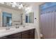 Bathroom featuring a double sink vanity and a separate room for the toilet and shower at 3507 E Jasper Dr, Gilbert, AZ 85296