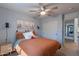 Bright bedroom with a closet, complemented by desert-themed decor and a ceiling fan at 3507 E Jasper Dr, Gilbert, AZ 85296