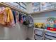 Well-organized closet with clothes, toys, and storage bins creating a clutter-free space at 3507 E Jasper Dr, Gilbert, AZ 85296