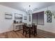 Dining room with chandelier, wood table and a coffee bar, ideal for entertaining at 3507 E Jasper Dr, Gilbert, AZ 85296