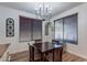 Cozy dining room featuring a dark wood table, chandelier and lots of natural light at 3507 E Jasper Dr, Gilbert, AZ 85296