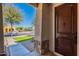 Inviting front entrance with wood door, decorative stone accents and a glimpse of the neighborhood at 3507 E Jasper Dr, Gilbert, AZ 85296