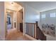 Second floor hallway with beautiful decor leading to the main bathroom at 3507 E Jasper Dr, Gilbert, AZ 85296