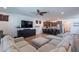 Open-concept living area flowing into a kitchen with bar seating and modern finishes at 3507 E Jasper Dr, Gilbert, AZ 85296