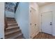 Carpeted stairs leading to the upper level, flanked by white walls and doors at 3507 E Jasper Dr, Gilbert, AZ 85296