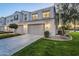 Exterior of home, showing driveway, garage, and well-maintained lawn at 4077 S Sabrina Dr # 138, Chandler, AZ 85248