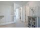 Upstairs hallway featuring white walls, neutral carpet and view to laundry room at 4077 S Sabrina Dr # 138, Chandler, AZ 85248