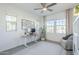 Bright home office featuring a modern desk, comfortable seating, and natural light from multiple windows at 4077 S Sabrina Dr # 138, Chandler, AZ 85248