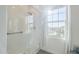 Bathroom glass shower enclosure with tiled walls, a window providing natural light, and chrome fixtures at 4077 S Sabrina Dr # 138, Chandler, AZ 85248