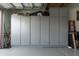 Garage wall featuring full wall cabinets with space above for maximum storage at 41615 W Caliente Dr, Maricopa, AZ 85138
