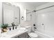 Bright bathroom featuring a shower-tub combination with modern fixtures at 43795 W Sagebrush Trl, Maricopa, AZ 85138