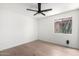 A bright bedroom with wood flooring and ceiling fan at 43795 W Sagebrush Trl, Maricopa, AZ 85138