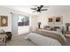 Serene main bedroom features neutral tones, natural light, and stylish decor at 43795 W Sagebrush Trl, Maricopa, AZ 85138