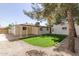 Inviting backyard with a covered patio and lush, green lawn at 458 N Drew W St # West, Mesa, AZ 85201