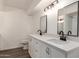 Modern bathroom features dual sinks and a white vanity with stylish hardware at 458 N Drew W St # West, Mesa, AZ 85201