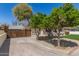 Charming home featuring mature citrus trees, lush lawn, and a quaint curb appeal at 458 N Drew W St # West, Mesa, AZ 85201