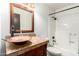 Rustic bathroom features a unique copper sink and custom tile countertop at 4721 W Eva St, Glendale, AZ 85302