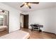 Bedroom with wood flooring, a ceiling fan, and a mirrored closet at 4721 W Eva St, Glendale, AZ 85302