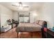 Bedroom featuring tile flooring, a ceiling fan, and a sliding glass door at 4721 W Eva St, Glendale, AZ 85302