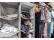 Bedroom closet with neatly arranged shelves and hanging clothes at 4721 W Eva St, Glendale, AZ 85302