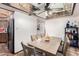 Bright dining room with Saltillo tile flooring, ceiling fan, and dining table at 4721 W Eva St, Glendale, AZ 85302