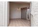 Charming entry featuring terracotta tile, neutral walls, and gray front door with holiday decor at 4721 W Eva St, Glendale, AZ 85302