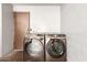 A laundry room features a washer and dryer with lots of extra space at 4721 W Eva St, Glendale, AZ 85302