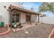 Covered patio features tiled floor and a cozy outdoor space at 4721 W Eva St, Glendale, AZ 85302