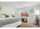 Modern bedroom with TV, plantation shutters and comfortable decor at 5217 E Tunder Cir, Phoenix, AZ 85044