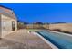 Large swimming pool in a well-kept backyard, featuring a gazebo and brick-paved patio at 5245 N 205Th Ln, Buckeye, AZ 85396