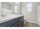 Modern bathroom featuring double vanity, chrome fixtures, and tile flooring at 5245 N 205Th Ln, Buckeye, AZ 85396