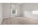 Cozy bedroom featuring neutral carpet, one window, and ample natural light at 5245 N 205Th Ln, Buckeye, AZ 85396