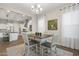 Charming dining area open to the kitchen, featuring a cozy table with seating for four at 5245 N 205Th Ln, Buckeye, AZ 85396