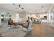 Open-concept living room flows into the kitchen, with plenty of seating and natural light at 5245 N 205Th Ln, Buckeye, AZ 85396