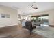 Open-concept living room with tile floors, light neutral paint, and a view of the pool at 5245 N 205Th Ln, Buckeye, AZ 85396