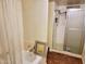 Bathroom with tiled floors and a shower with glass door at 5301 W Vernon Ave, Phoenix, AZ 85035