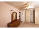 Bright bedroom with a ceiling fan, mirror, and closet with sliding doors at 5301 W Vernon Ave, Phoenix, AZ 85035