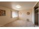 Bright bedroom with carpeted floors, a closet and neutral paint at 5301 W Vernon Ave, Phoenix, AZ 85035