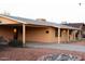 Single story desert home with orange stucco exterior and desert landscape at 5301 W Vernon Ave, Phoenix, AZ 85035