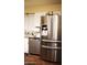 Stainless steel refrigerator with water dispenser complementing the kitchen's design at 5301 W Vernon Ave, Phoenix, AZ 85035